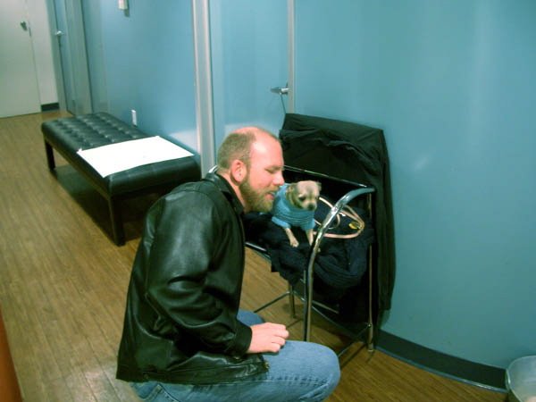 Dave converses with a very small dog
