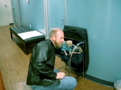 Dave converses with a very small dog